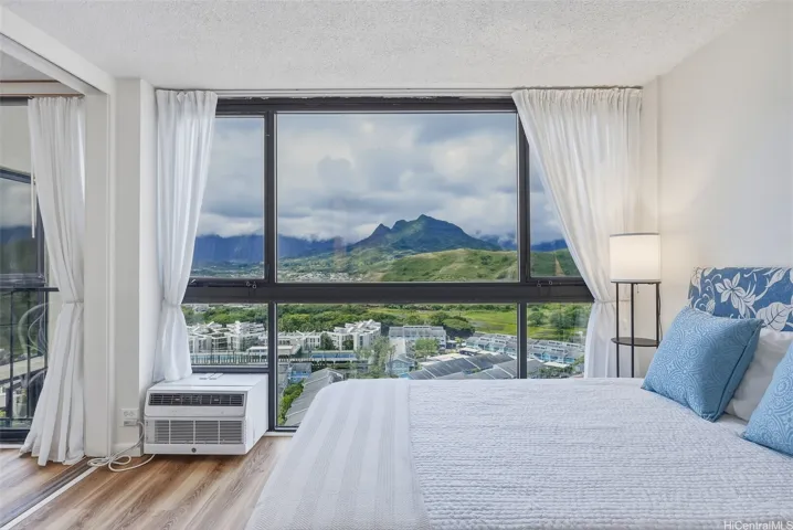 The bedroom has sliding panels so that it can be opened to the living area or closed off for privacy.