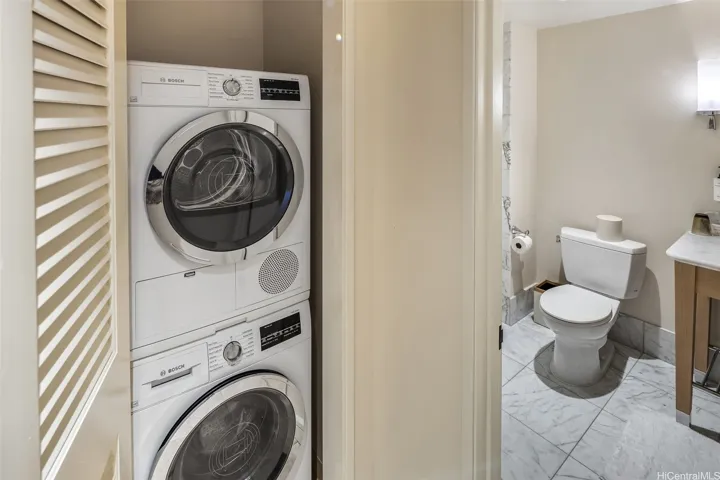 Washer and dryer located near third full bath