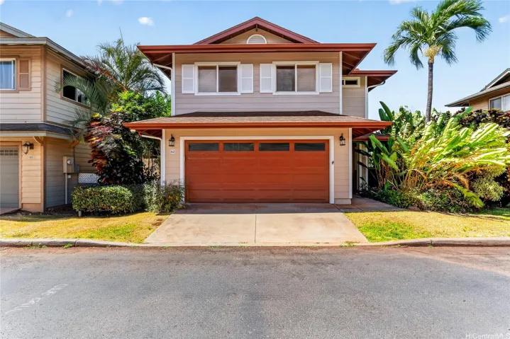 Beautiful two-story home with inviting curb appeal and a spacious two-car garage.