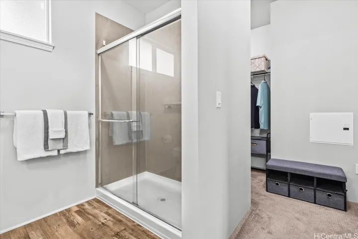 With a step-in shower and spacious walk-in closet room