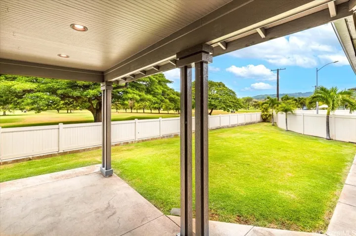 Relax beneath the covered lanai overlooking Coral Creek Golf Course