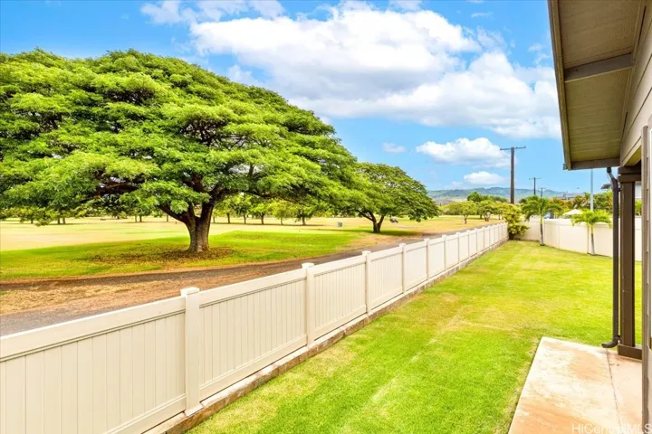 Expansive 5,606 sq ft corner lot with only one neighboring home, golf course, and sunset views