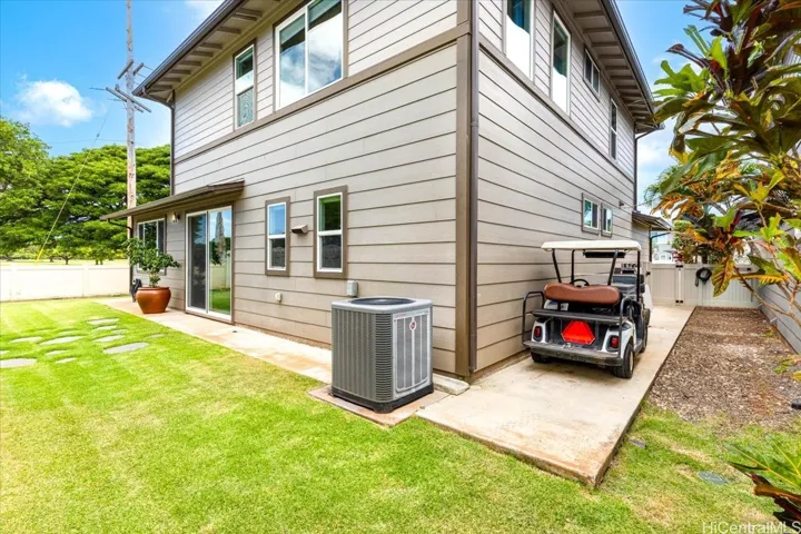 Golf cart pad, 469 sq ft garage, and driveway parking