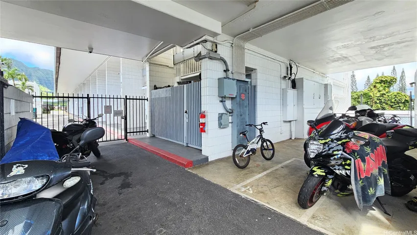 Covered, fenced area for bicycles & mortorcycles.