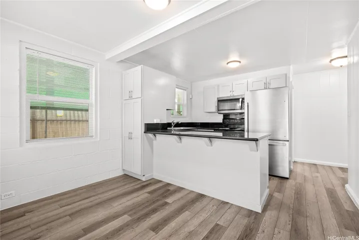 front door view of living room and kitchen.