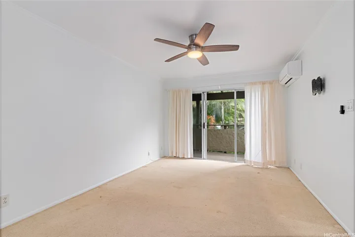 Primary bedroom with spit AC and private lanai.