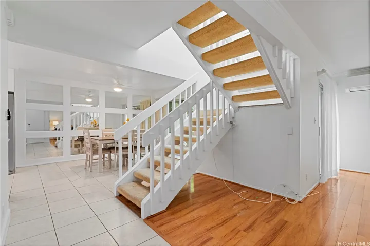Split level townhome, stairs leading to the 3 bedrooms & 2 baths upstairs.