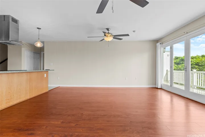 The kitchen has a large room that leads to a deck that offers nice views.