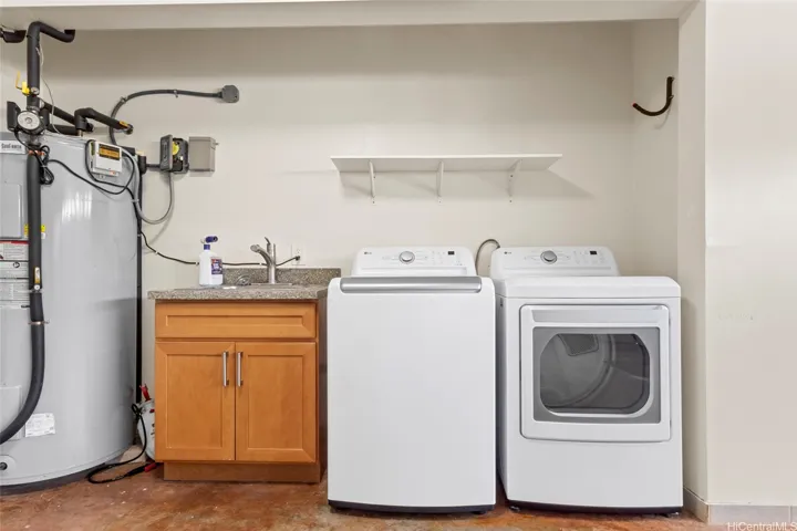 Washer/Dryer, utility sink and water heater are all out in the garage.