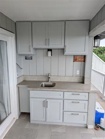 A close up of the wet bar on the upstairs deck - with recently painted cabinetry.