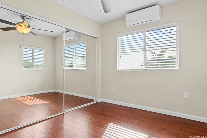 Mirrored closet doors in this bedroom.