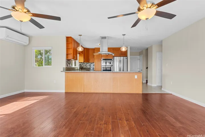 Note the split AC, this could be a grand dining room off the kitchen, or use it for both dining and lounging.