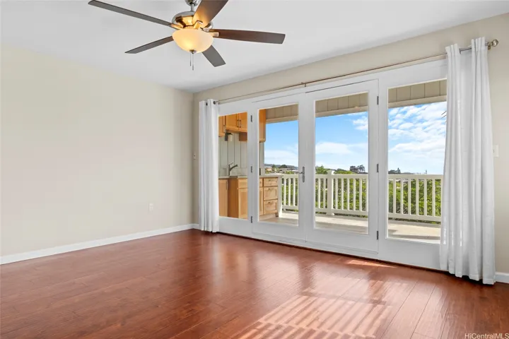 The upstairs has a den with another deck - this one has a wet bar.