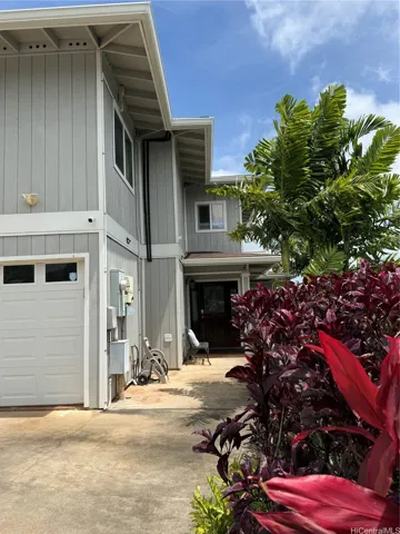 Home is nicely landscaped along the driveway/entrance.