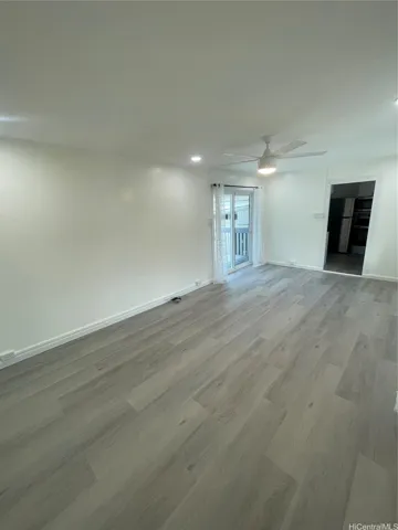 LIVING ROOM WITH NEW CEILING FAN