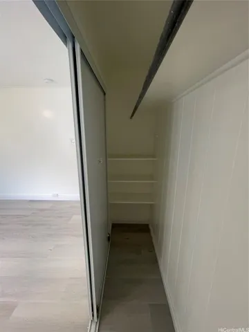 MASTER BEDROOM WITH SHELVES IN CLOSET
