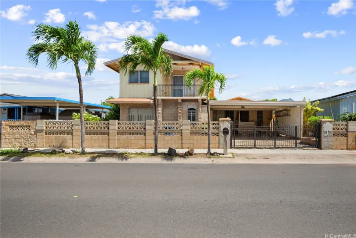 7-bedrooms and 4 full baths are tucked neatly behind the private gate of 87-531 Manuu St.