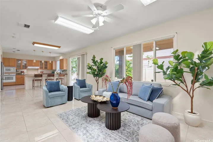 A second living area near the kitchen provides additional space for relaxing or gathering.