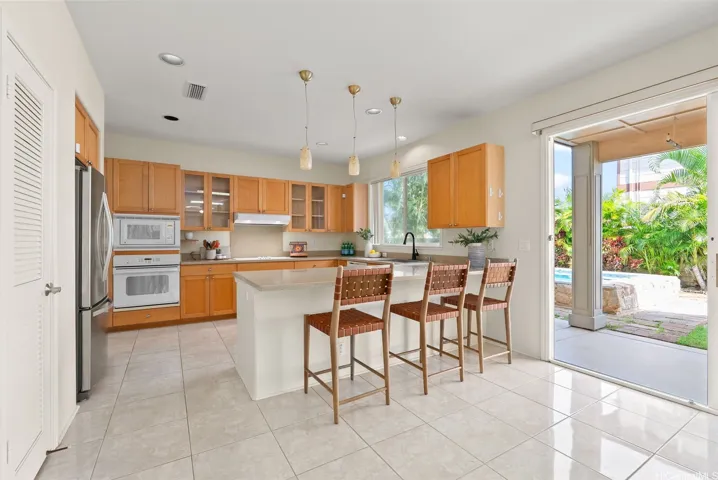 Peninsula seating provides a convenient place for casual meals or conversation while cooking.