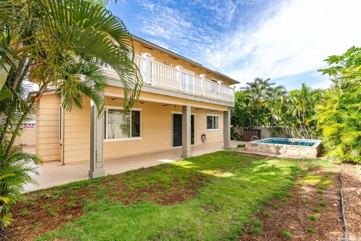 The covered lanai overlooks the private pool and fenced backyard.