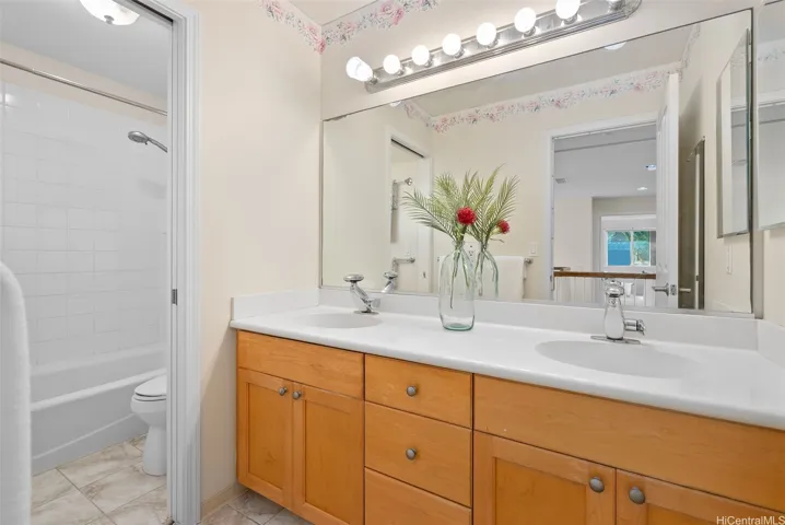 The upstairs hall bathroom includes a tub-and-shower combination.