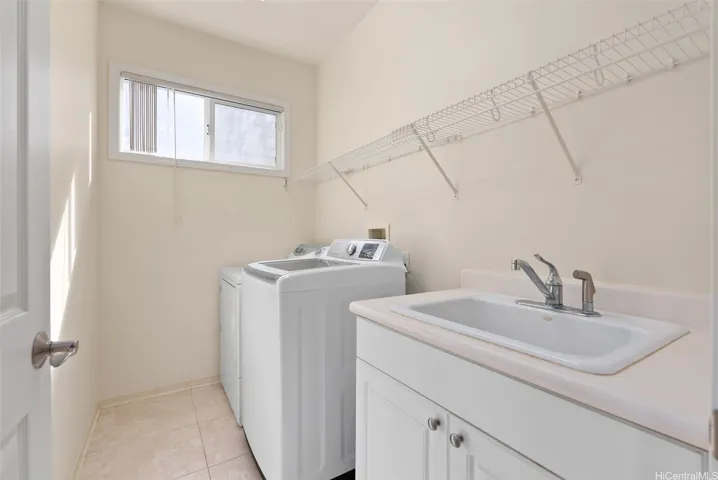 The interior laundry room includes built-in storage. Washer/Dryer included.