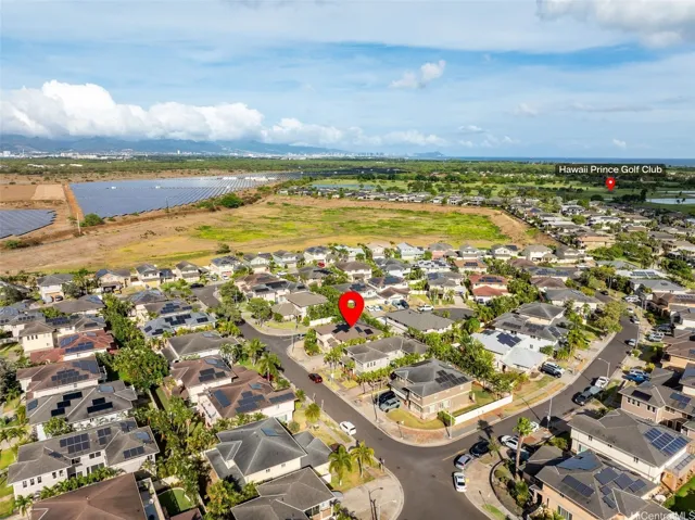 Aerial view showing the home’s corner-lot location within Woodbridge II.