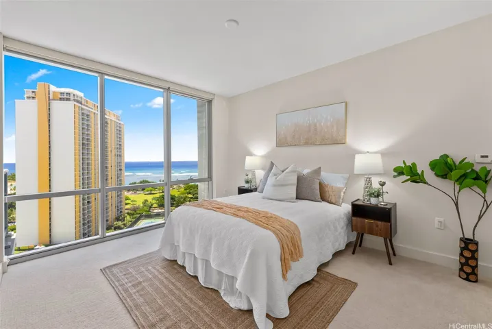 Primary bedroom, ensuite with 2 closet spaces & ocean views.