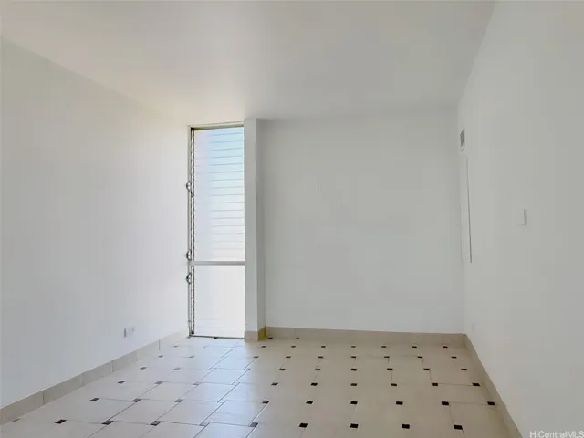 Bedroom with ceramic tile floors & golf cours