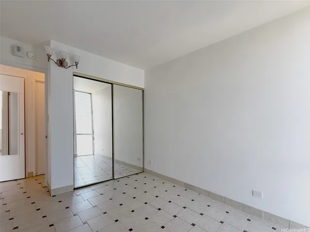 Bedroom with ceramic tile floors & golf cours