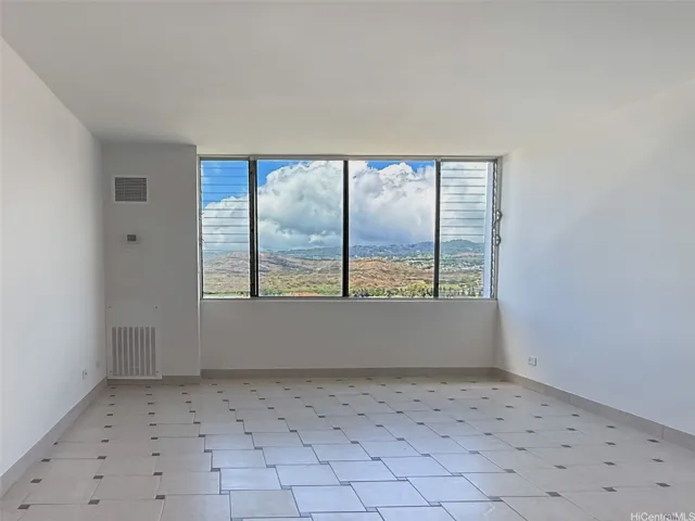 Living room with spectacular golf course & mountain view