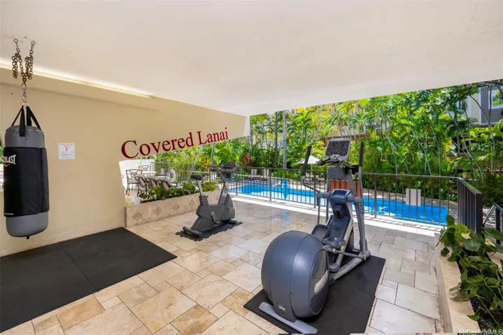 Gym Equipment Overlooking Pool