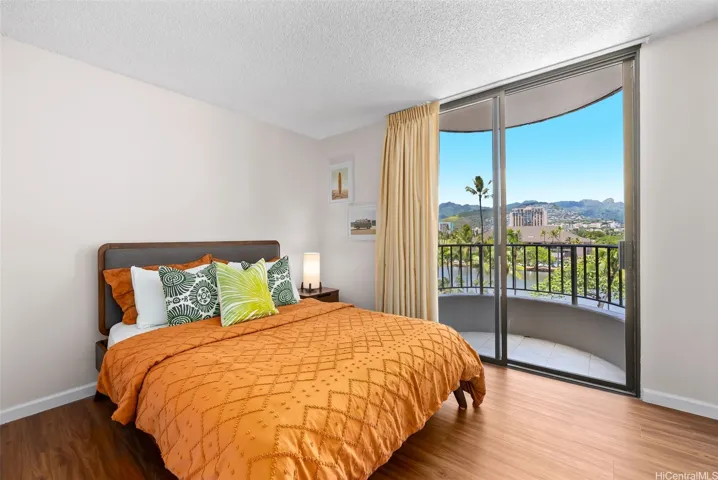 First bedroom with mountain and city views