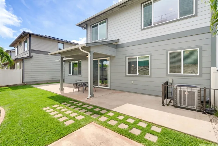 Offering excellent backyard versatility with dual covered and uncovered patio spaces designed for the ideal outdoor lifestyle. Photo is enhanced.