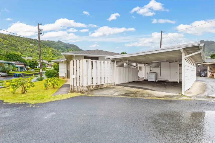 2-car carport with storage room and laundry room, shower and toilet in back