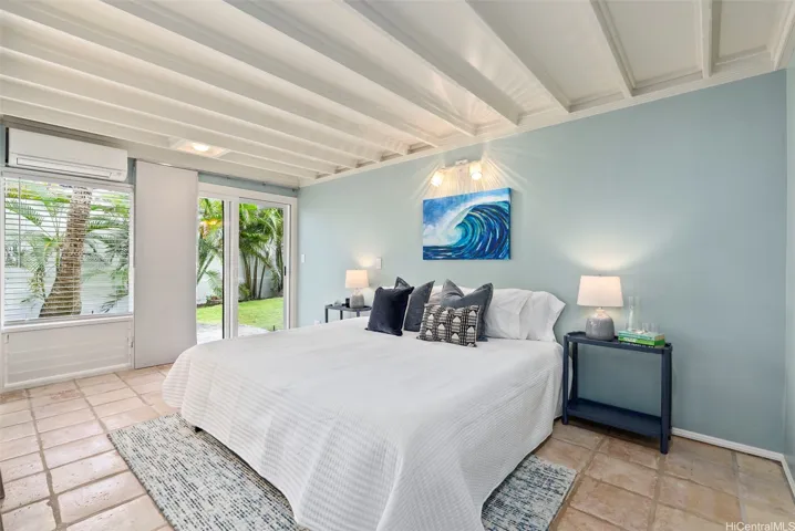 Bedroom #1 on first floor with sliding doors to outside.
