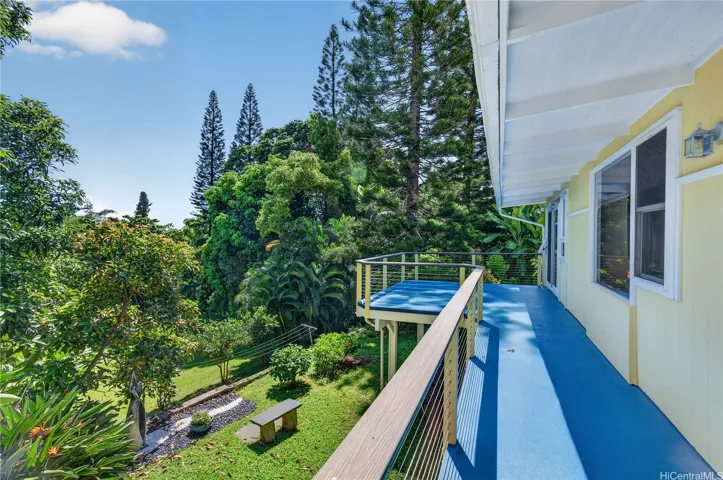 Lanai expands the width of the home!  Views of the back yard from main living areas, primary bedroom, and second bedroom+.