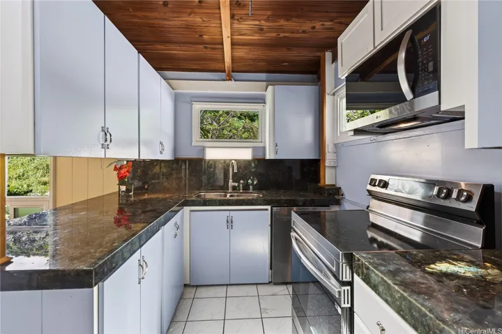 Kitchen with labroadite counters and almost a year old appliances.