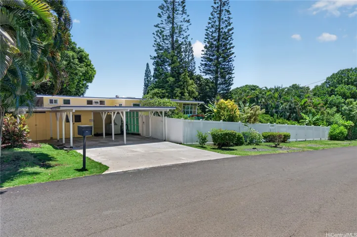 Two car carport with extra storage and direct entry to the main home.  Fenced and gated front yard and front door entries
