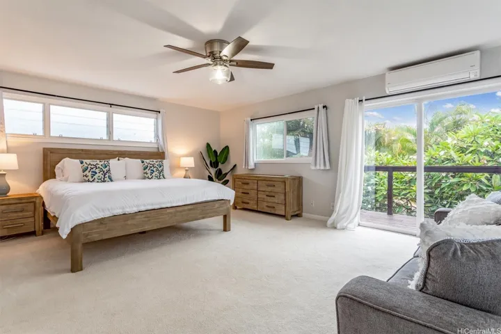Primary bedroom with lanai and mountain views