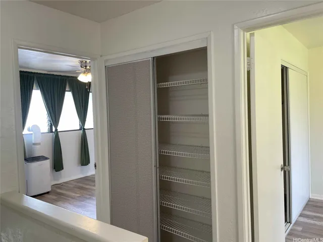 Top of stairs looking into the 2 bedrooms and hallway closet