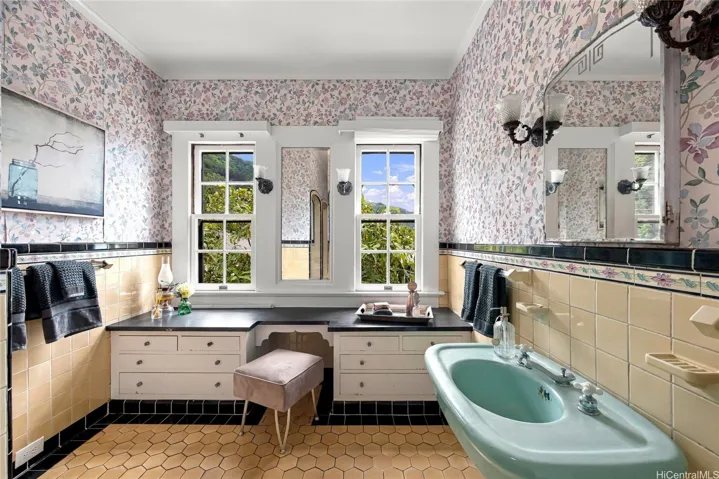 Original second-story bathroom is bright and airy.