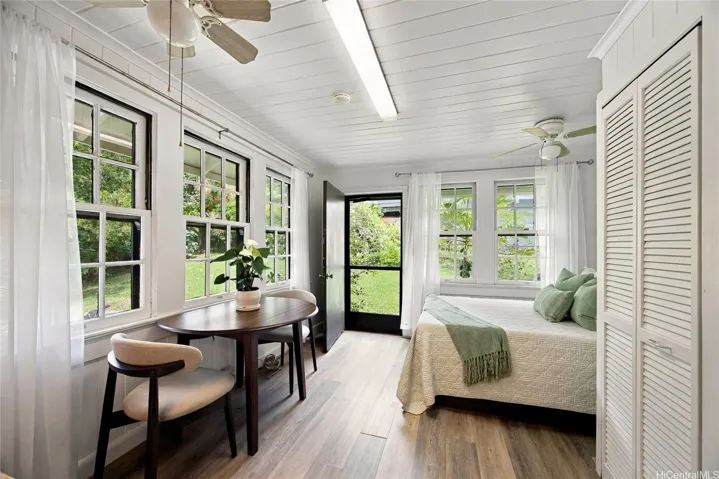 Classic double-hung windows in the studio look out onto the private yard.