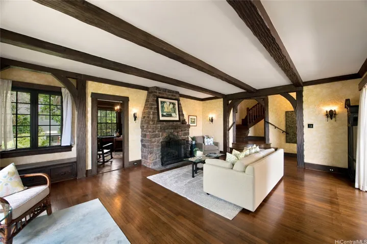 Original hardwood floors still grace this home. Notice the classic staircase in the hall.