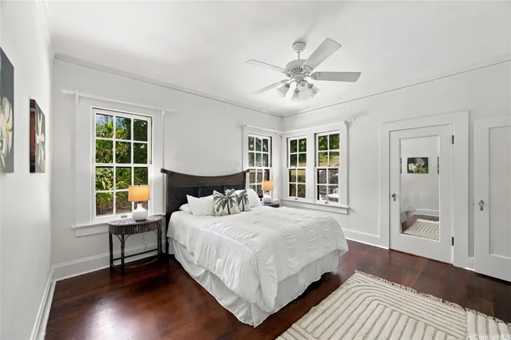 A cheerful and spacious ground-floor bedroom, just off the kitchen, looks out onto the rear patio.