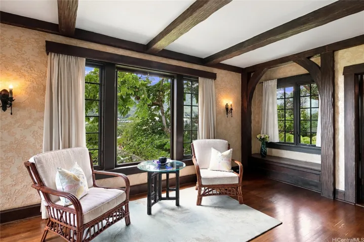 What a peaceful spot. Original wrought-iron sconces flag the picture window.