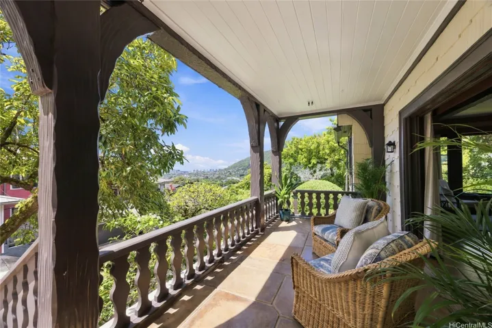 Enjoy Manoa Valley, ocean, and Honolulu skyline views from the breezy covered lanai.