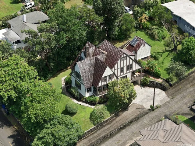 The property is grand, with front, back & side gardens, plus a shared driveway parcel in addition to the land square ft.