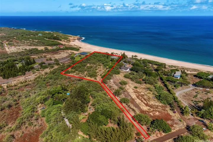5.9 acre estate home with grand entrance driveway. Directly on Papohaku Beach Molokai.