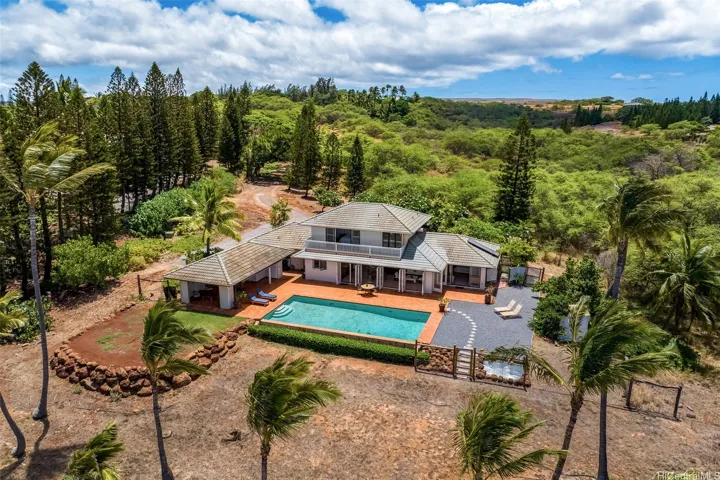 Oceanfront pool just steps from sandy beach and pristine waters of Molokai's West side.